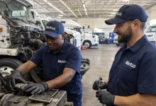Motus Hino Parow apprentice working on a commercial truck during diesel mechanic training